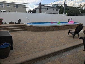 raised pool patio brick around raised semi inground in ground pool bullnose coping levittown patios